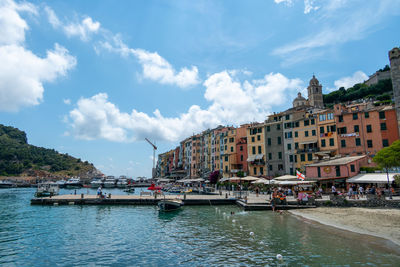 Portovenere, italy, july 30, 2023. view, from the bank, of the village of portovenere