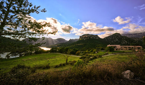 Scenic view of landscape and mountains against sky