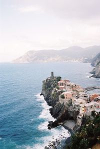 High angle view of sea and cityscape against sky