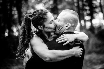 Portrait of couple kissing outdoors