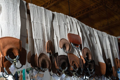 Low angle view of clothes hanging at market stall