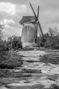 Traditional windmill against sky