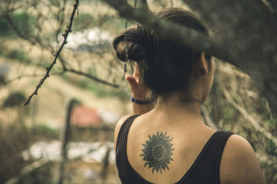 Rear view of woman in trees