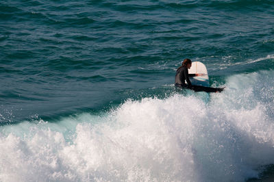 Man surfing in sea