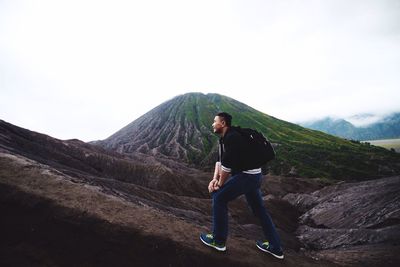 Full length of man on mountain against clear sky