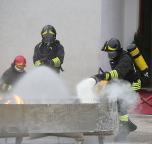 Firefighters extinguishing fire