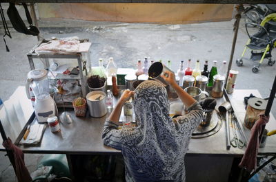 High angle view of people working on table