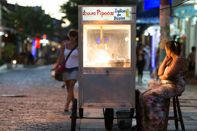 People on street in city at night