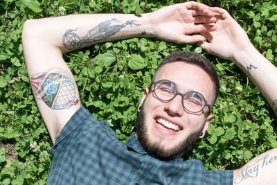 Portrait of smiling young man wearing eyeglasses