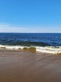 Scenic view of sea against clear blue sky