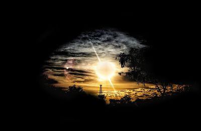 Silhouette trees against sky during sunset