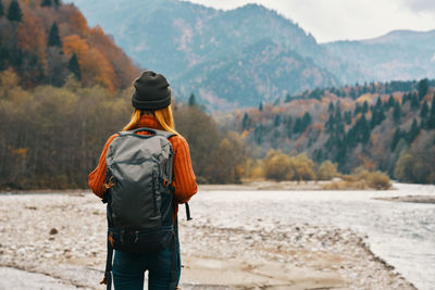 Rear view of man looking at mountains