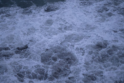 High angle view of surf on beach