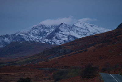 Scenic view of snowcapped mountains against sky