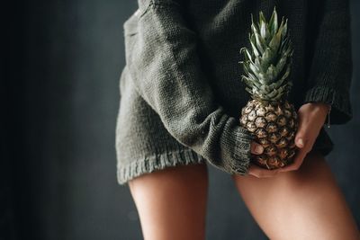 Midsection of woman holding ice cream