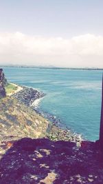 Scenic view of sea against cloudy sky