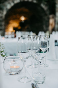 Close-up of wine glasses on table