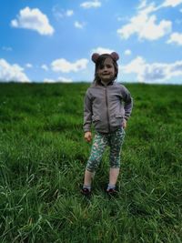 Full length of girl standing on field