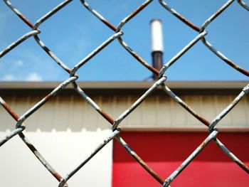 Full frame shot of chainlink fence against clear sky