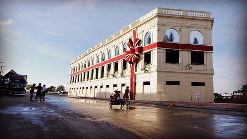 People in front of historic building