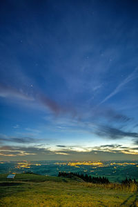 Scenic view of landscape against sky at night