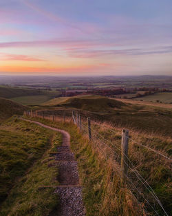 Scenic view of landscape against sky during sunset