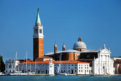 San giorgio maggiore by grand canal against clear blue sky