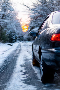 Close-up of car on road