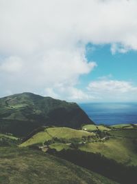 Scenic view of sea against cloudy sky