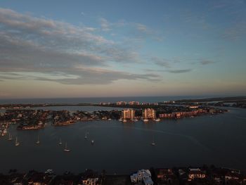 High angle view of sea and buildings against sky