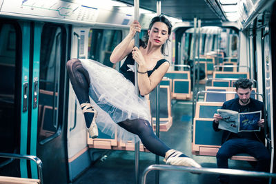 High angle view of woman sitting at train