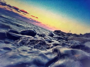 Scenic view of sea at sunset