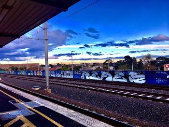 Railway tracks against blue sky