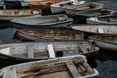 Stack of abandoned boats moored