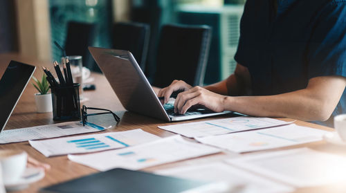 Low section of person working on table