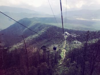 Overhead cable car against mountains