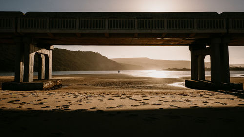 Bridge over sea against sky