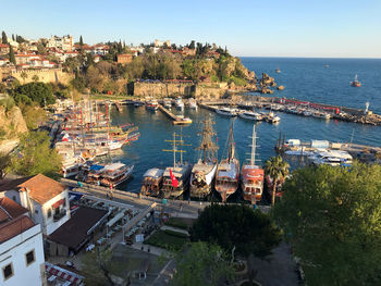 High angle view of townscape by sea against sky