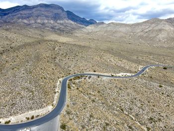 High angle view of mountain road against cloudy sky