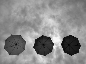 Low angle view of umbrella against sky