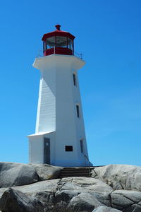 Peggy's cove lighthouse, nova scotia canada, coastline, ocean, sunny, no people.