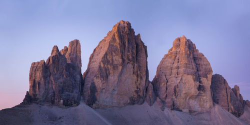 Three lavaredo peaks at sunrise with blue and purple sky -tre cime di lavaredo	