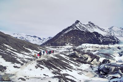 Scenic view of mountains against sky during winter