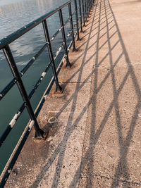 High angle view of railing by footpath