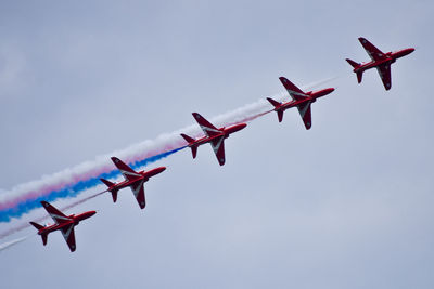 Low angle view of airplane flying in sky