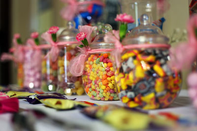 Close-up of candies in jar on table
