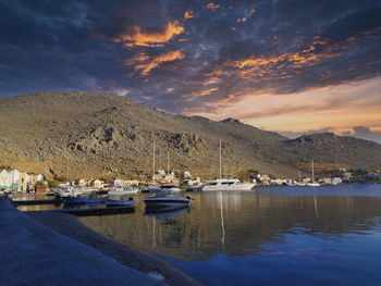 Boats in marina at sunset