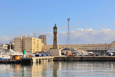 Buildings in city against sky