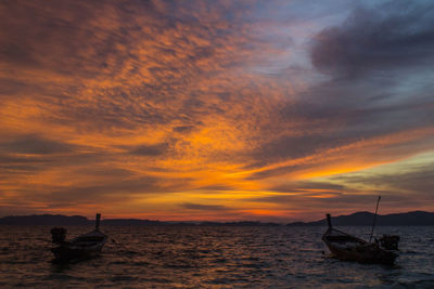 Scenic view of sea against orange sky