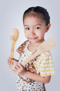 Portrait of smiling girl holding ice cream